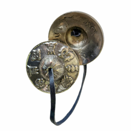 Tingsha de bronce con diseño de Ashtamangala