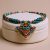 Handmade in Nepal by skilled artisans, this Inlaid Stone Pendant Necklace features Turquoise and Coral, embodying energies of peace, protection, and clarity for your spiritual journey.