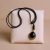 This handmade Black Onyx Pendant Necklace from Nepal reflects the stone's spiritual essence, promoting ambition, protection, and balance on your journey towards inner strength and well-being.