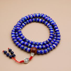 This handmade Tibetan Inlaid Yak Bone Prayer Mala from Nepal is a cherished companion for meditation, reminding us to cultivate compassion and embrace the beauty of impermanence.