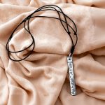 Handcrafted in Nepal by skilled artisans, this Tibetan Mantra Carved Pendant Necklace embodies the teachings of compassion and enlightenment, guiding you on your journey towards inner peace.