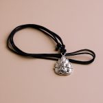 Handcrafted in Nepal by skilled artisans, this White Metal Ganesha Pendant Necklace serves as a spiritual talisman, inviting prosperity and wisdom into your life.