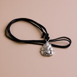 Handcrafted in Nepal by skilled artisans, this White Metal Ganesha Pendant Necklace serves as a spiritual talisman, inviting prosperity and wisdom into your life.