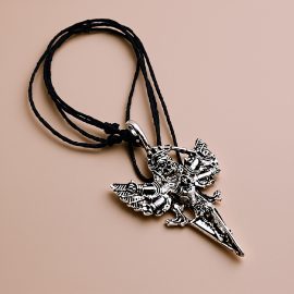 Honor Yama, the lord of death and justice, with this handmade pendant necklace from Nepal. A symbol of impermanence, it inspires deeper understanding and spiritual growth.