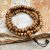 Antique Yak Bone Japa Mala, handmade in Nepal by skilled artisans, serves as a spiritual tool, embodying transformation and aiding in meditation and the cultivation of compassion.