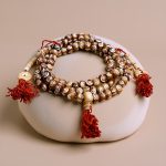 Carved from yak bone, this handmade prayer mala from Nepal serves as a vital tool for meditation, embodying resilience and the essence of life&rsquo;s impermanence.
