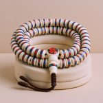 Inlaid Yak Bone Japa Mala, handmade in Nepal by skilled artisans, supports meditation and prayer while connecting you to the profound spiritual heritage of the Himalayas.
