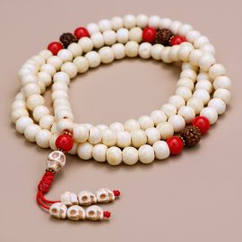 Handmade in Nepal by skilled artisans, this Skull Bead Yak Bone Japa Mala embodies the wisdom of impermanence, guiding practitioners in their spiritual journey and reflection on life's transience.