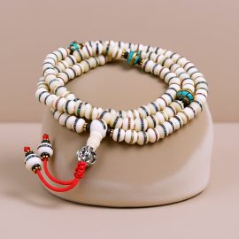 This Yak Bone Prayer Mala, handmade in Nepal by skilled artisans, serves as a powerful reminder of impermanence, guiding practitioners on their spiritual journey with mindfulness and resilience.