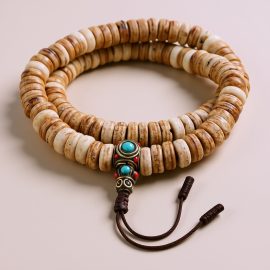 Yak Bone Japa Mala, handmade in Nepal by skilled artisans, symbolizes the cycle of life, guiding meditation and fostering presence in your spiritual journey.