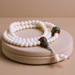 Handmade in Nepal by skilled artisans, this 6 mm conch shell mala embodies oceanic energy, symbolizing flow and transformation, enhancing meditation and spiritual practice with its protective qualities.