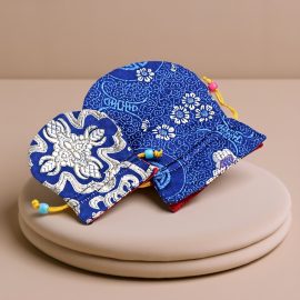 This Dark Blue Silk Mala Bag, handmade in Nepal by skilled artisans, is a sacred container for your mala beads, embodying wisdom and protection on your spiritual journey.