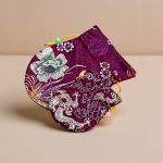 This Dark Pink Silk Mala Bag, handmade in Nepal by skilled artisans, protects your mala beads while embodying purity and wisdom through its dragon embroidery. A meaningful spiritual accessory for your journey.