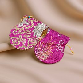 Handmade in Nepal by skilled artisans, this Light Pink Silk Mala Bag protects your mala beads while embodying love, compassion, and the essence of your spiritual journey.