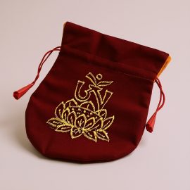 Handmade in Nepal by skilled artisans, this Tibetan Om Embroidered Mala Bag serves as a sacred vessel for your mala, embodying purity, resilience, and the essence of spiritual awakening.