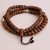 Handmade in Nepal by skilled artisans, this Antique Inlay Bodhi Seed Prayer Mala with Yak Bone spacers supports meditation and spiritual growth, connecting you to the essence of Lord Buddha.