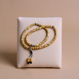 Handmade in Nepal by skilled artisans, this Antique Lotus Seed Mala features lotus seeds and Tibetan inlaid beads, symbolizing purity and resilience, supporting your meditation and spiritual journey.