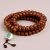 Antique Nepali Bodhi Seed & Buddha Eyes Japa Mala, handmade by skilled artisans in Nepal, serves as a sacred tool for meditation, embodying wisdom and promoting spiritual growth.