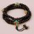 The handmade Inlaid Brass Raktu Seed Japa Mala, crafted in Nepal, supports meditation and mantra recitation, fostering clarity and serenity on the spiritual path.