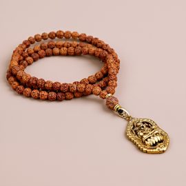 This handmade Rudraksha bead mala, crafted by skilled artisans in Nepal, honors Lord Ganesha, promoting spiritual growth and protection while connecting to the divine essence of Lord Shiva.