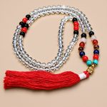 7 Chakra Crystal Stone Japa Mala harmonizes the body's energy centers. Handmade in Nepal by skilled artisans, it supports your spiritual journey and fosters balance and alignment.