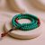 Handmade in Nepal by skilled artisans, this 10 mm Flat Turquoise Stone Mala with Resin Coral Spacer aids spiritual practice, fostering calmness, balance, and a deeper connection to the divine.