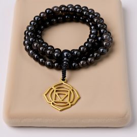 Handmade in Nepal by skilled artisans, this Black Obsidian Stone Prayer Mala serves as a powerful tool for healing, protection, and spiritual growth, fostering harmony within.