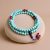This handmade Blue Turquoise Stone Japa Mala, crafted by skilled artisans in Nepal, supports meditation and spiritual practice while promoting love and compassion through its harmonizing energy.