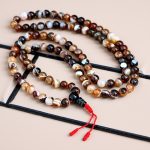 Brown Agate Stone Japa Mala, handmade in Nepal by skilled artisans, aids in meditation, grounding energy, and healing, enriching your spiritual journey with each mindful repetition.