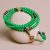 This Green Jade Stone Prayer Mala, handmade in Nepal by skilled artisans, supports Vajrayana practitioners, fostering wisdom, compassion, and tranquility on their spiritual journey.