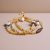 Handmade in Nepal by skilled artisans, this mala features a Citrine stone, conch, and dorjee symbols, embodying positivity and spiritual strength for your practice.