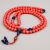 The Dzi Bead Powder Coral Stone Yoga Mala, handmade by skilled artisans in Nepal, harmonizes protective Dzi stone, vibrant coral, and calming lapis lazuli for your spiritual journey.