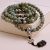 This handmade mala, crafted by skilled artisans in Nepal, features Labradorite and the Double Dorje, serving as a sacred tool for meditation, energy restoration, and spiritual clarity.