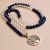Handmade in Nepal by skilled artisans, this Lapis Lazuli & Crystal Stone Japa Mala is a sacred tool for meditation, enhancing clarity and fostering inner peace in your spiritual practice.