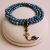 Handmade in Nepal by skilled artisans, this Lotus Charm African Turquoise Stone Mala aids meditation and spiritual growth, fostering protection, emotional balance, and a deeper connection to inner peace.