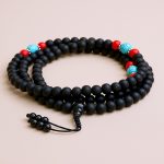 Handmade in Nepal by skilled artisans, this Matte Onyx Stone Prayer Mala features 108 beads, supporting your spiritual journey with its calming energy and enhancing your meditation practice.