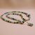 Natural Blue Calcite Stone with Dorjee on Conch Shell Mala, handmade in Nepal by skilled artisans, supports meditation, enhances communication, and fosters tranquility on your spiritual path.