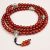 Handmade in Nepal by skilled artisans, this Tibetan Mantra Carnelian Stone Prayer Mala supports meditation, emotional clarity, and vitality, guiding you on your spiritual journey.
