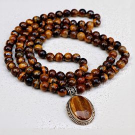 Handmade in Nepal by skilled artisans, this Tiger Eye Stone Japa mala promotes mindfulness and protection, guiding you towards inner peace and spiritual growth.