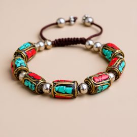 This handmade Inlaid Brass Bead Wrist Mala, crafted by skilled artisans in Nepal, serves as a spiritual companion, inviting mindfulness and devotion in your journey through Vajrayana Buddhism.