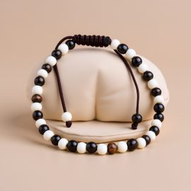 Handmade in Nepal by skilled artisans, this 4 MM Black & White Yak Bone Wrist Mala embodies spiritual growth, reminding us of our interconnectedness and the impermanence of life.