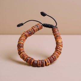 Handmade in Nepal by skilled artisans, this Fossil Yak Bone Wrist Mala serves as a reminder of life's impermanence, embodying spiritual transformation and cultural heritage in every bead.