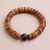 Fossil Yak Bone Wrist Mala, handmade in Nepal by skilled artisans, symbolizes life&rsquo;s impermanence and enlightenment, serving as a cherished companion for meditation and reflection.