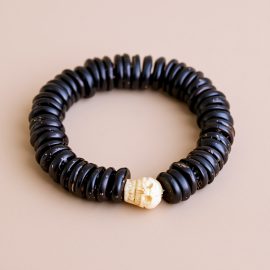 This handmade wrist mala, crafted from dark yak bone and adorned with skull beads, embodies the teachings of impermanence, inviting reflection and mindfulness. Made by skilled artisans in Nepal.
