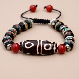 Tibetan Dzi Yak Bone Wrist Mala, handmade in Nepal by skilled artisans, embodies the cycle of life and death, offering protection and fostering inner peace on your spiritual journey.