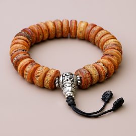 Tibetan Mantra Yak Bone Wrist Mala, handmade in Nepal by skilled artisans, symbolizes life&rsquo;s impermanence and offers protection, enriching your spiritual journey towards inner peace and clarity.