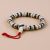 Handmade in Nepal by skilled artisans, this White Inlaid Yak Bone Wrist Mala symbolizes purity and transformation, serving as a supportive companion on your spiritual journey.