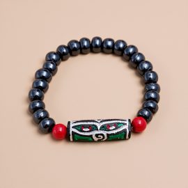 Wisdom Buddha Eye Yak Bone Wrist Mala/Bracelet, handmade in Nepal by skilled artisans, serves as a reminder of impermanence and a companion for meditation and reflection.