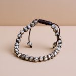 Handmade in Nepal by skilled artisans, this 6 MM Conch-Shell Mantra Carved Beads Wrist Mala serves as a reminder of life's impermanence and enhances spiritual connection and protection.