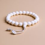Handmade in Nepal by skilled artisans, this Conch Shell Wrist Mala symbolizes power and spiritual strength, enhancing vitality and protection while fostering inner peace and harmony.